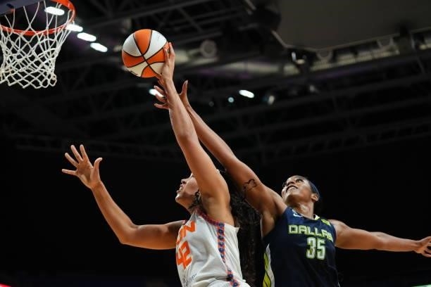 Charli Collier of the Dallas Wings attempts to block a shot by Brionna Jones of the Connecticut Sun during the game on September 7, 2021 at College...