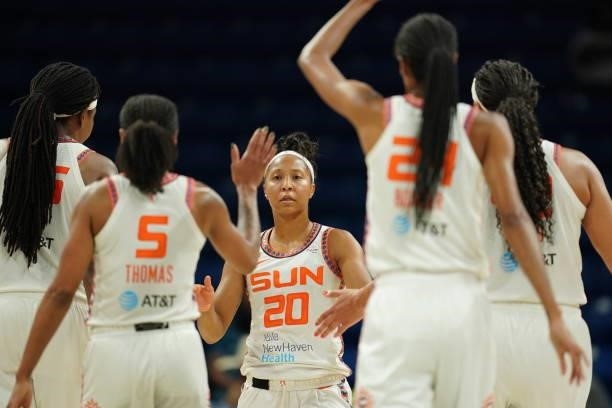 Briann January of the Connecticut Sun high-fives teammates during the game against the Dallas Wings on September 7, 2021 at College Park Center in...