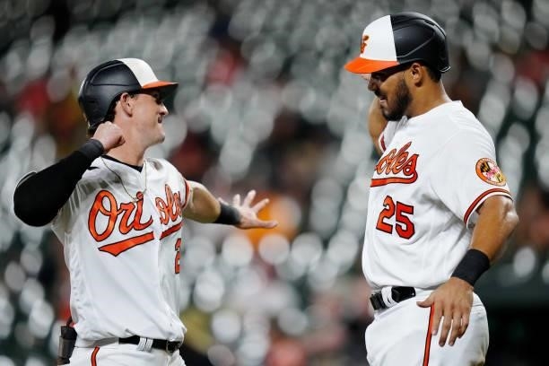 Austin Hays of the Baltimore Orioles is congratulated by Anthony Santander after hitting a two run home run in the bottom of the third inning during...