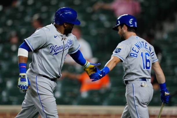 Carlos Santana of the Kansas City Royals celebrates with Andrew Benintendi after hitting a solo home run in the top of the fourth inning during the...