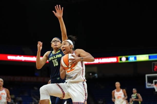 Briann January of the Connecticut Sun drives to the basket during the game against the Dallas Wings on September 7, 2021 at College Park Center in...