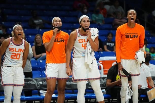 Briann January, Stephanie Jones, Brionna Jones and DeWanna Bonner of the Connecticut Sun cheer from the bench during the game against the Dallas...