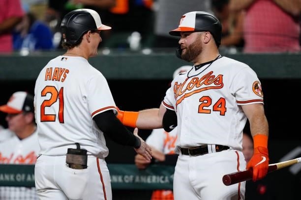 Austin Hays of the Baltimore Orioles is congratulated by DJ Stewart after hitting a two run home run in the bottom of the third inning during the...