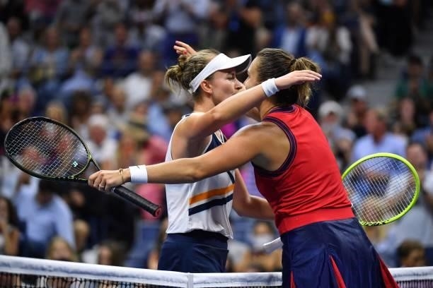 Belarus's Aryna Sabalenka hugs Czech Republic's Barbora Krejcikova after winning their 2021 US Open Tennis tournament women's quarter-finals match at...