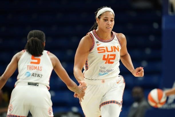 Brionna Jones of the Connecticut Sun high-fives teammate Jasmine Thomas during the game Dallas Wings on September 7, 2021 at College Park Center in...