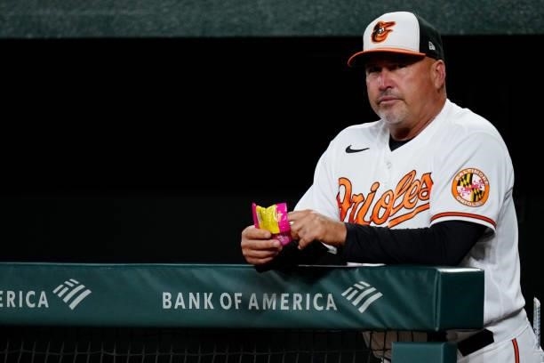 Baltimore Orioles Manager Brandon Hyde looks on from the dugout during the game between the Kansas City Royals and the Baltimore Orioles at Oriole...