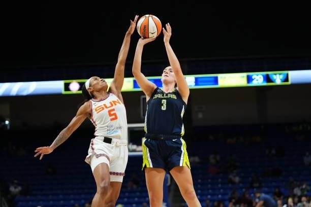 Jasmine Thomas of the Connecticut Sun reaches to block a shot by Marina Mabrey of the Dallas Wings during the game on September 7, 2021 at College...