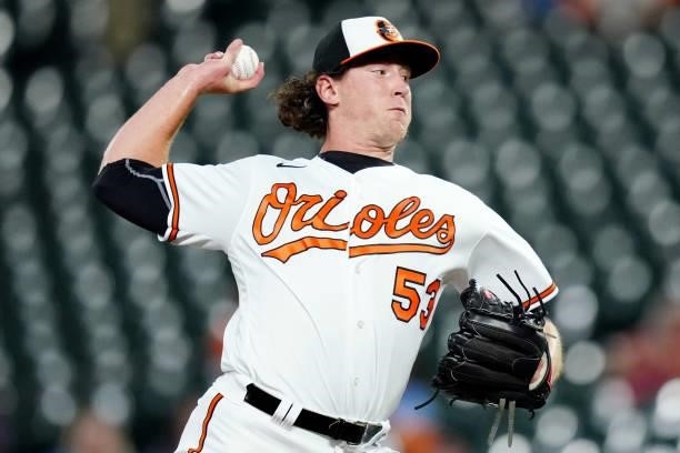Mike Baumann of the Baltimore Orioles pitches during the game between the Kansas City Royals and the Baltimore Orioles at Oriole Park at Camden Yards...