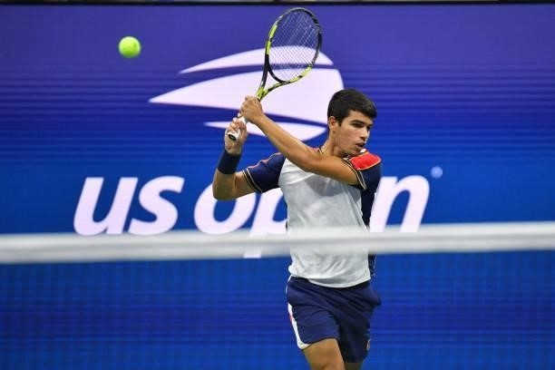 Spain's Carlos Alcaraz hits a return to Canada's Felix Auger-Aliassime during their 2021 US Open Tennis tournament men's quarter-finals match at the...