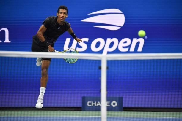 Canada's Felix Auger-Aliassime hits a return to Spain's Carlos Alcaraz during their 2021 US Open Tennis tournament men's quarter-finals match at the...