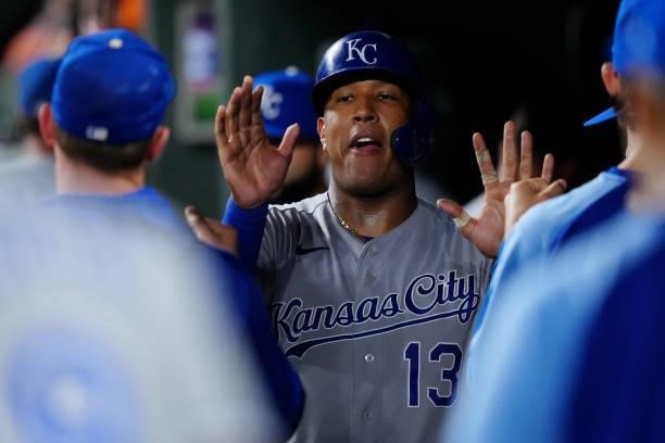 Salvador Perez of the Kansas City Royals celebrates in the dugout after scoring a run in the top of the eighth inning during the game between the...