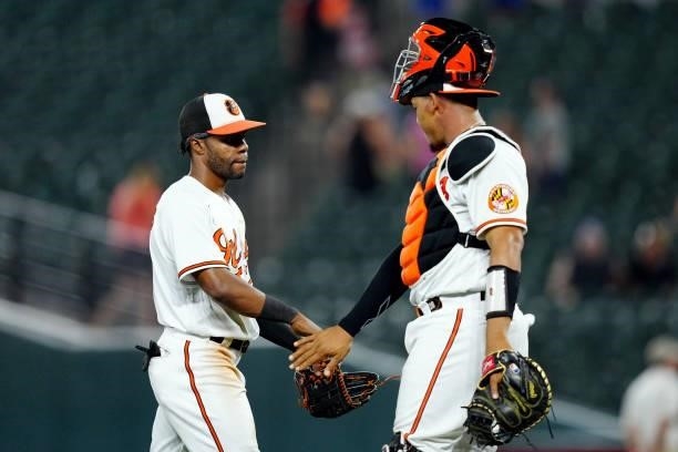 Cedric Mullins and Pedro Severino of the Baltimore Orioles celebrate after the Orioles defeated the Kansas City Royals 7-3 at Camden Yards on...