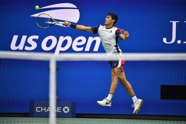 Spain's Carlos Alcaraz hits a return to Canada's Felix Auger-Aliassime during their 2021 US Open Tennis tournament men's quarter-finals match at the...