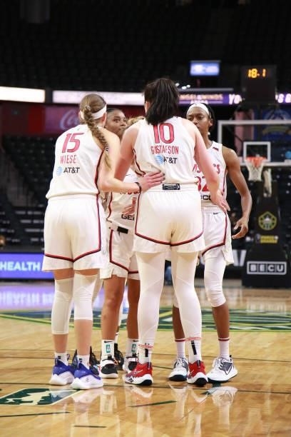 The Washington Mystics huddle up during the game against the Seattle Storm on September 7, 2021 at the Angel of the Winds Arena, in Everett,...