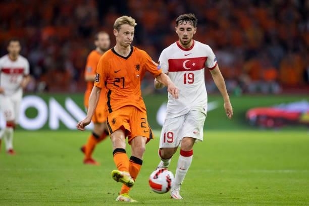 Frenkie de Jong of Netherlands and Orkun Kokcu of Turkey Battle for the ball during the 2022 FIFA World Cup Qualifier match between Netherlands and...