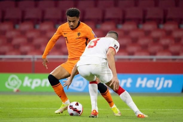 Donyell Malen of Netherlands and Merih Demiral of Turkey Battle for the ball during the 2022 FIFA World Cup Qualifier match between Netherlands and...