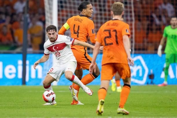 Virgil van Dijk of Netherlands and Orkun Kokcu of Turkey Battle for the ball during the 2022 FIFA World Cup Qualifier match between Netherlands and...