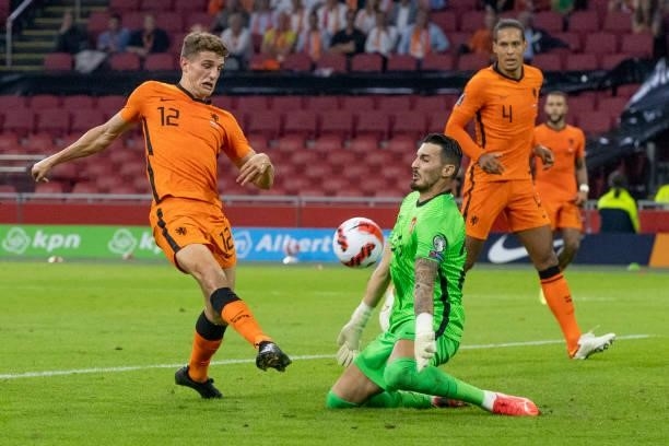 Guus Til of Netherlands and Ugurcan Cakir of Turkey battle for the ball during the 2022 FIFA World Cup Qualifier match between Netherlands and Turkey...