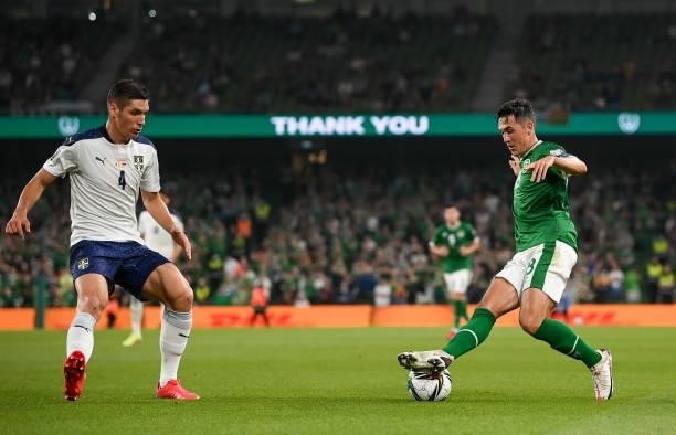 Dublin , Ireland - 7 September 2021; Jamie McGrath of Republic of Ireland in action against Nikola Milenkovi of Serbia during the FIFA World Cup 2022...