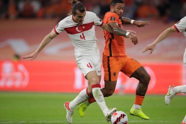 Caglar Soyuncu of Turkey, Memphis Depay of Holland during the World Cup Qualifier match between Holland v Turkey at the Johan Cruijff Arena on...