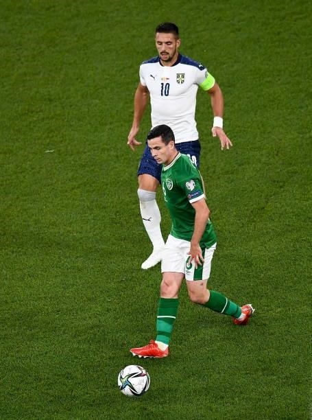 Dublin , Ireland - 7 September 2021; Josh Cullen of Republic of Ireland and Duan Tadi of Serbia during the FIFA World Cup 2022 qualifying group A...