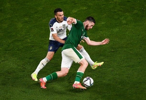 Dublin , Ireland - 7 September 2021; Matt Doherty of Republic of Ireland and Filip Kosti of Serbia during the FIFA World Cup 2022 qualifying group A...