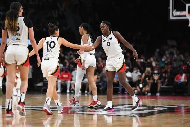 Kelsey Plum of the Las Vegas Aces high fives Jackie Young during the game against the Minnesota Lynx on September 8, 2021 at the Michelob ULTRA Arena...