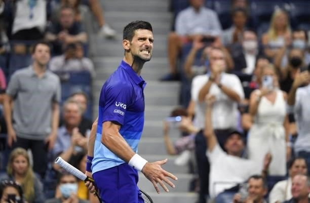 Serbia's Novak Djokovic reacts to wining a game against Italy's Matteo Berrettini during their 2021 US Open Tennis tournament men's quarter-finals...