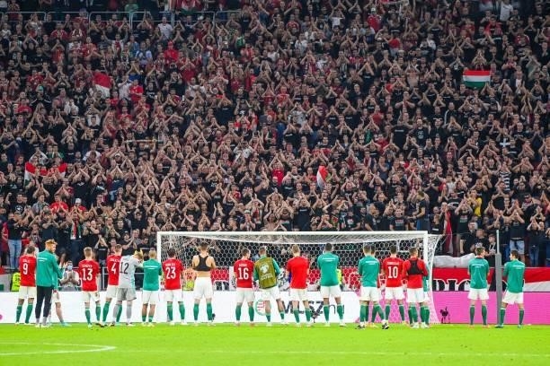 Hungary's players sing their national anthem with their supporters after the FIFA World Cup Qatar 2022 qualification Group I football match between...