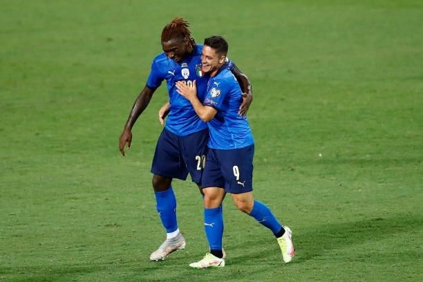 Giacomo Raspadori of Italy and Moise Kean of Italy celebrate after scoring their team's first goal during the 2022 FIFA World Cup Qualifier match...