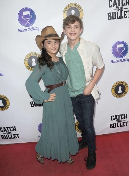 Mason McNult and Izzie Florez arrive for the Red Carpet Screening Of "Catch The Bullet