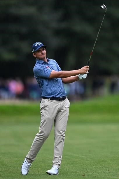 South Africa's Christiaan Bezuidenhoutplays a shot on the 17th on Day 1 of the PGA Championship at Wentworth Golf Club in Surrey, south west of...