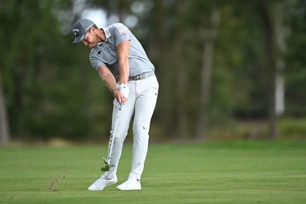 England's Danny Willett plays a shot on the 9th on Day 1 of the PGA Championship at Wentworth Golf Club in Surrey, south west of London on September...