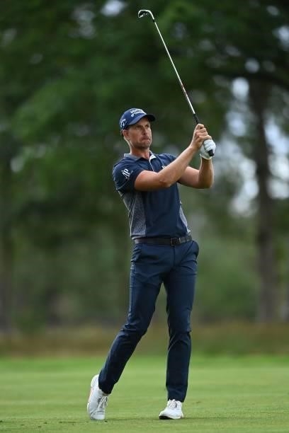 Sweden's Henrik Stenson plays a shot on the 9th on Day 1 of the PGA Championship at Wentworth Golf Club in Surrey, south west of London on September...
