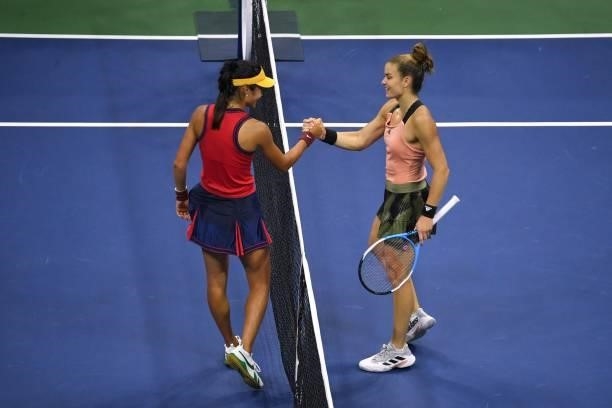 Britain's Emma Raducanu shakes hands with Greece's Maria Sakkari after winning their 2021 US Open Tennis tournament women's semifinal match at the...
