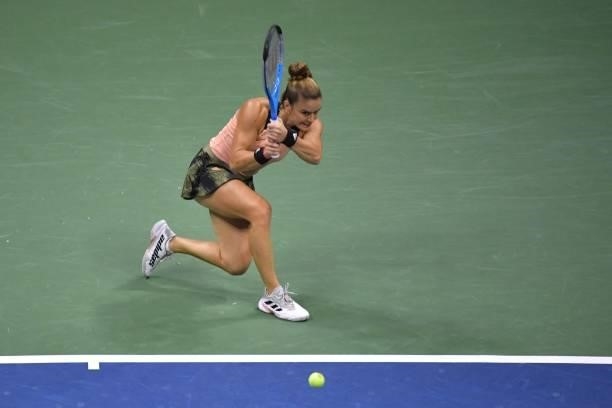Greece's Maria Sakkari hits a return to Britain's Emma Raducanu during their 2021 US Open Tennis tournament women's semifinal match at the USTA...
