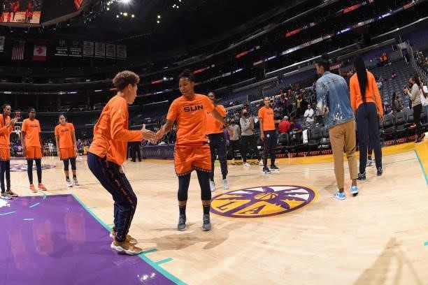 Natisha Hiedeman of the Connecticut Sun high fives Briann January before the game against the Los Angeles Sparks on September 9, 2021 at the Staples...