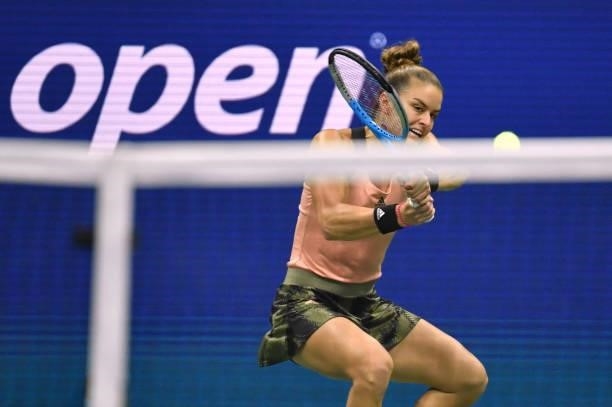 Greece's Maria Sakkari hits a return to Britain's Emma Raducanu during their 2021 US Open Tennis tournament women's semifinal match at the USTA...
