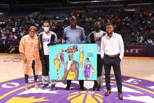 Former Los Angeles Sparks head coach, Michael Cooper is honored by the Los Angeles Sparks with a painting during the game against the Connecticut Sun...