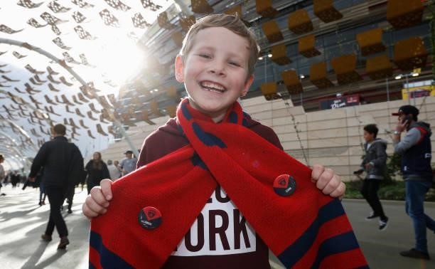 Young Demons fan poses for a photograph during the 2021 AFL First Preliminary Final match between the Melbourne Demons and the Geelong Cats at Optus...