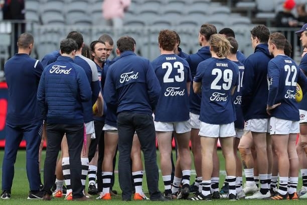 Senior coach Chris Scott of the Cats speaks to the team before warm up during the 2021 AFL First Preliminary Final match between the Melbourne Demons...