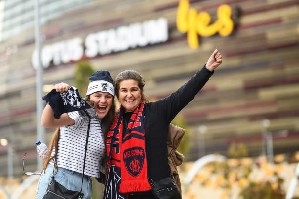 Demons and Cats fans show their support during the 2021 AFL First Preliminary Final match between the Melbourne Demons and the Geelong Cats at Optus...