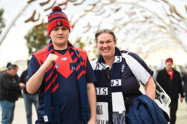 Demons and Cats fans show their support during the 2021 AFL First Preliminary Final match between the Melbourne Demons and the Geelong Cats at Optus...