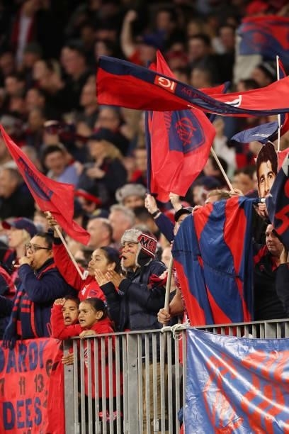 Melbourne cheer squad celebrate a goal during the 2021 AFL First Preliminary Final match between the Melbourne Demons and the Geelong Cats at Optus...
