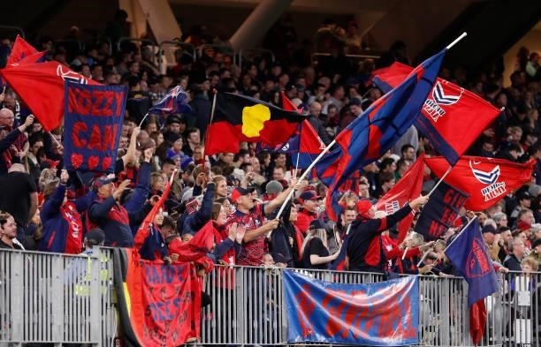 Demons fans celebrate during the 2021 AFL First Preliminary Final match between the Melbourne Demons and the Geelong Cats at Optus Stadium on...