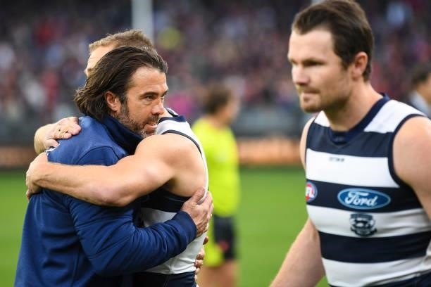 Chris Scott, Senior Coach of the Cats embraces Joel Selwood of the Cats during the 2021 AFL First Preliminary Final match between the Melbourne...