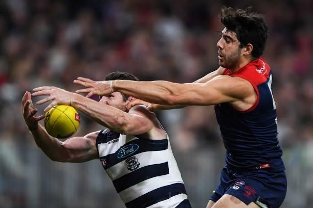 Christian Petracca of the Demons competes for a mark with Patrick Dangerfield of the Cats during the 2021 AFL First Preliminary Final match between...