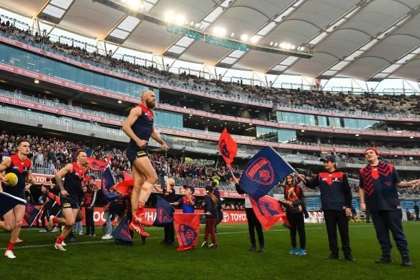 Max Gawn of the Demons leads his team onto the field during the 2021 AFL First Preliminary Final match between the Melbourne Demons and the Geelong...