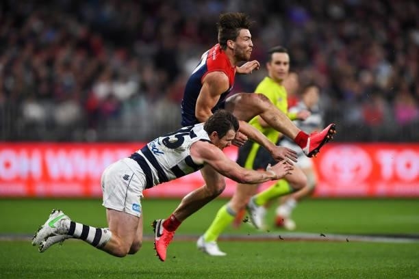Jack Viney of the Demons kicks the ball under pressure during the 2021 AFL First Preliminary Final match between the Melbourne Demons and the Geelong...