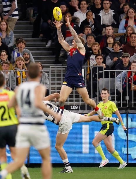 James Harmes of the Demons takes a spectacular mark over Lachie Henderson of the Cats during the 2021 AFL First Preliminary Final match between the...
